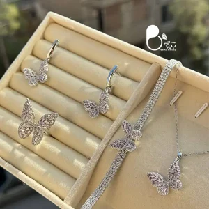 قیمت و خرید ست پروانه پینک نگین باگت نقره‌ای💎 استیل گرید ۱ با آبکاری نانو | کیفیت عالی و طرح خاص