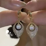 خرید و قیمت گوشواره مروارید رنگ ثابت مثل طلا از سایت بیوتی
