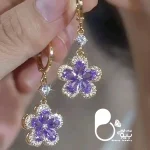 قیمت و خرید گوشواره گل بنفش ترک رنگ ثابت کپی طلا گوشواره آمترا وارداتی از ترکیه💎فروشگاه زیورآلات بیوتی