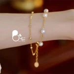 قیمت و خرید دستبند مروارید دولاین طلایی استیل رنگ ثابت کپی طلا از بیوتی